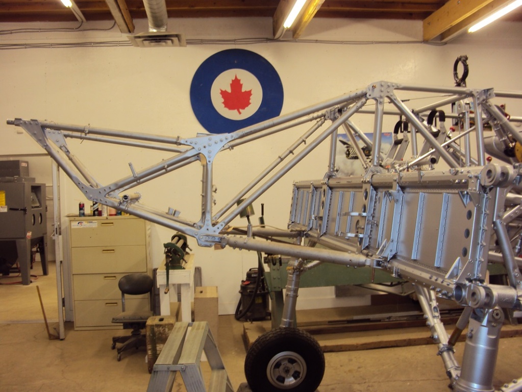 Coming together:  The engine truss is trial fitted to the fuselage and center section.