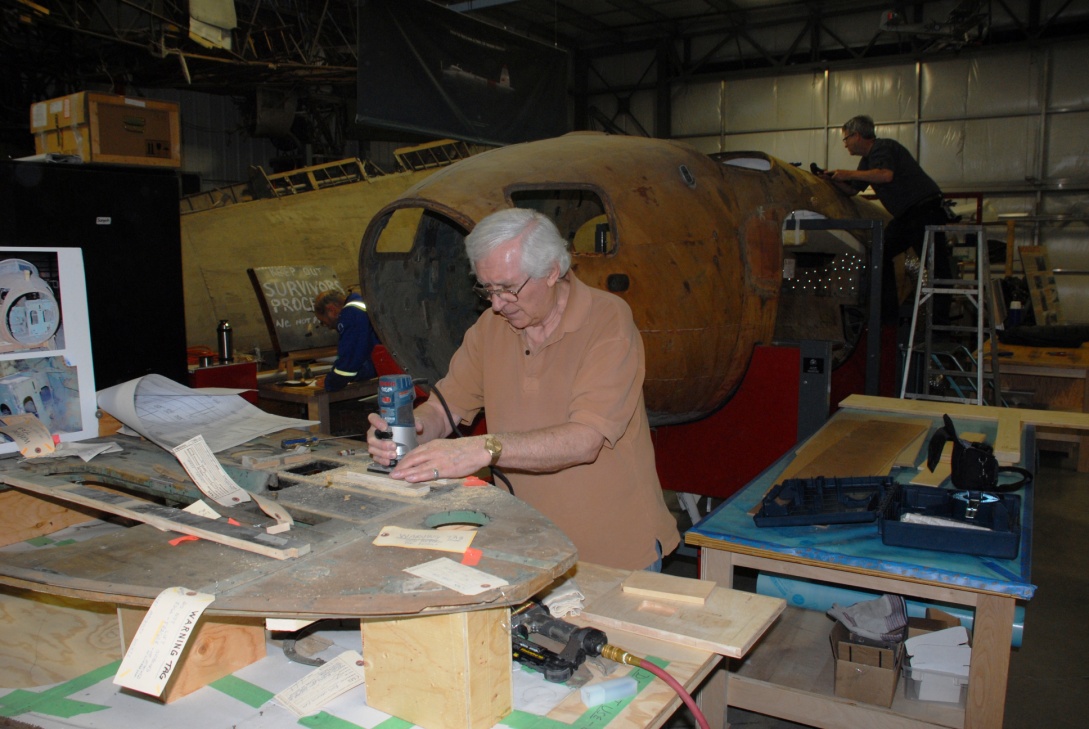 Using a purpose built pattern cutter, Wayne removes damaged areas of the cockpit floor.