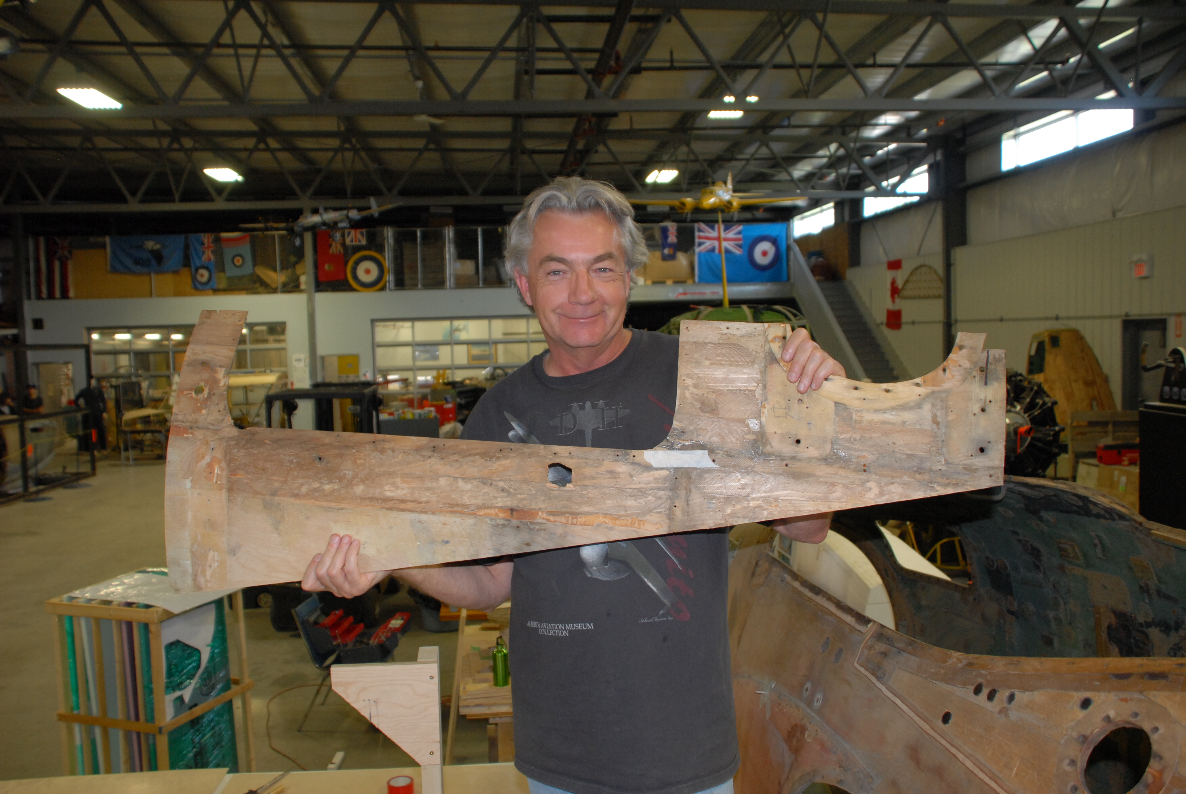 Proud president with first skin removed from the Mosquito fuselage.