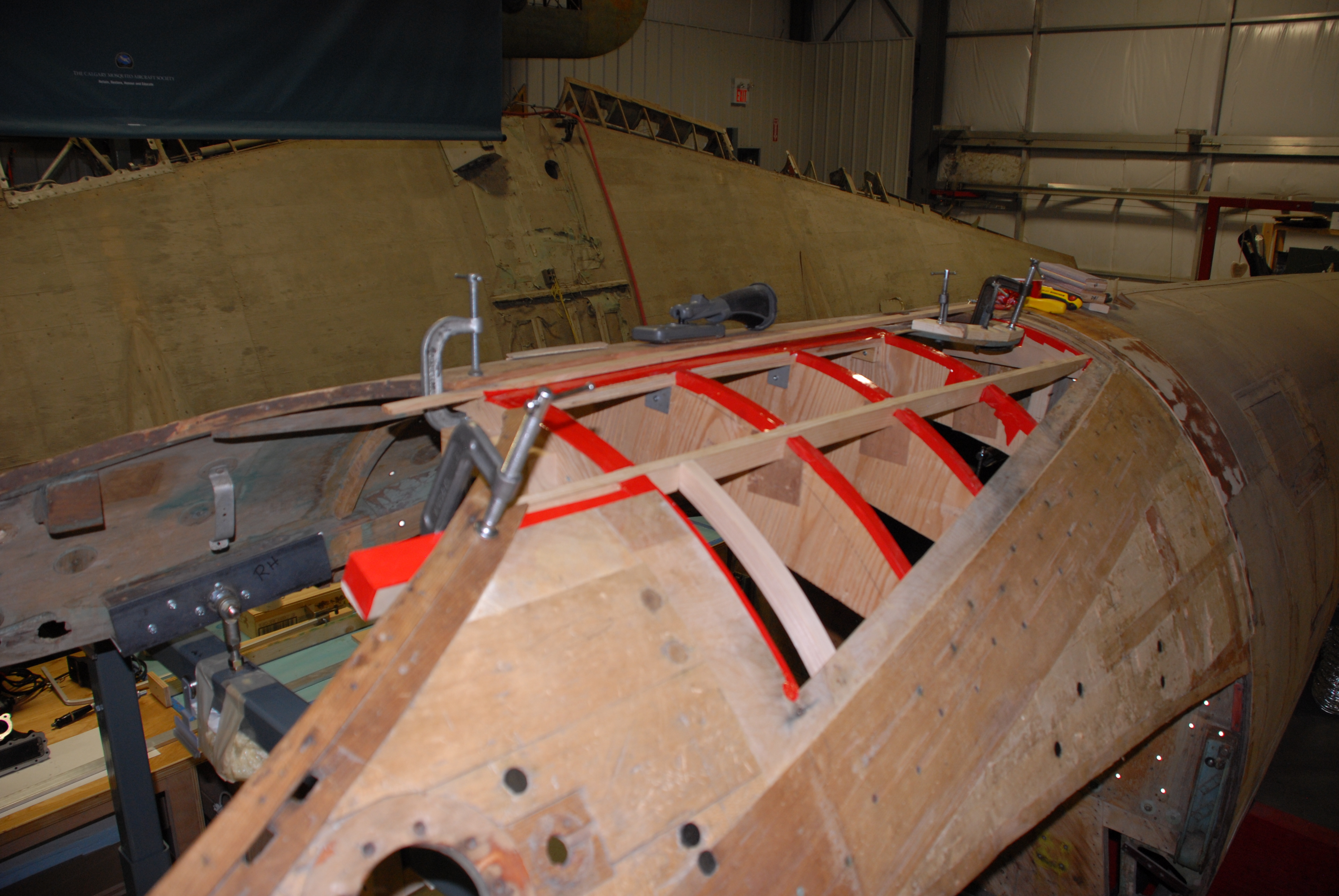 Upper fuselage, just aft of the canopy.